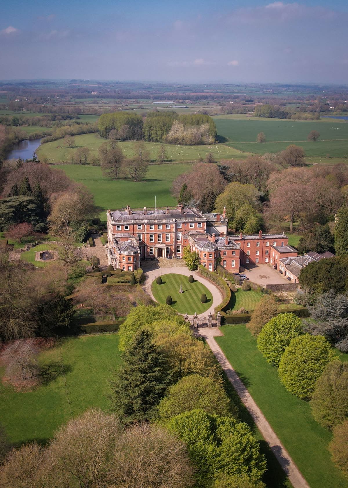 An English country house and its grounds from the air